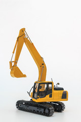 Yellow excavator  model  on  a white background with bucket lift up