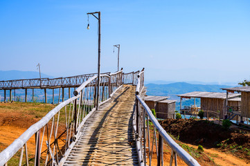 Wooden bridge with scenic view at Doi Sa Ngo viewpoint