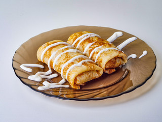 pancakes with sour cream on a plate