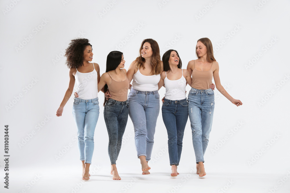Wall mural group of women with different body types on light background - Wall murals