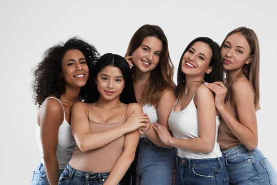 Group Of Women With Different Body Types On Light Background