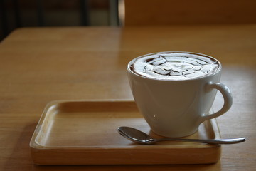 Coffee cup on table in coffee shop
