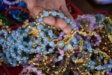 Bracelets made of multi-colored jade sold by vendors to tourists.