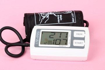 electronic blood pressure meter and red heart