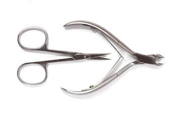 Nail clippers and scissors isolated on white background