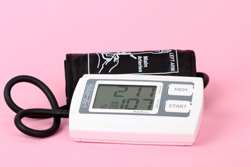 electronic blood pressure meter and red heart