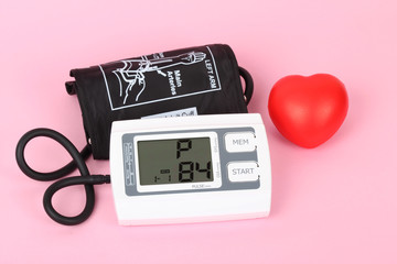 electronic blood pressure meter and red heart