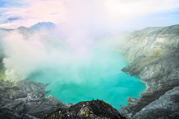 View from above, stunning view of the Ijen volcano with the turquoise-coloured acidic crater lake. The Ijen volcano complex is a group of composite volcanoes located in East Java, Indonesia.