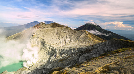 View from above, stunning view of the Ijen volcano with the turquoise-coloured acidic crater lake....