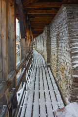 Wooden corridor on the defense medieval wall in Old Town Tallinn. Estonia