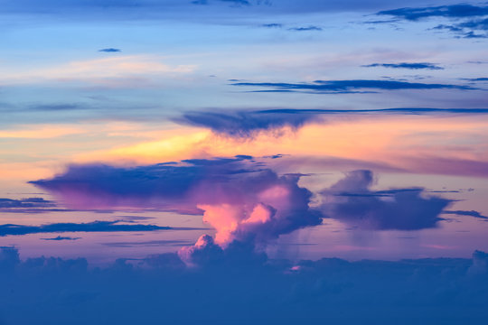 Stunning view of some beautiful clouds with different shapes illuminated during sunrise. © Travel Wild