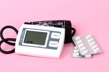 electronic blood pressure meter and red heart