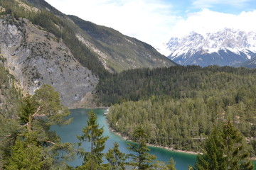 Fototapeta na wymiar Alpine lake in the spring sun