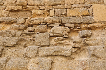 Very old stone wall texture, close-up architectural background