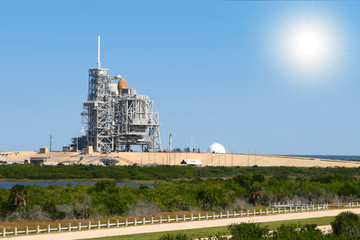 space shuttle on launch platform with son