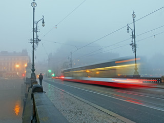 moving tram in the morning fog