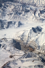 aerial view of open-pit mine under snow in Atacama desert, Chile