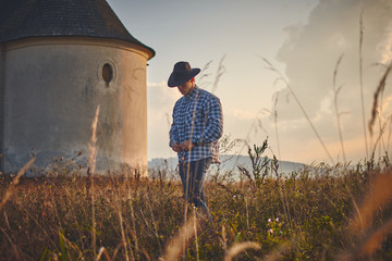 Young man hard working farmer looking with satisfied face,  vintage