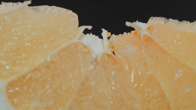 Pomelo fruit, orange lith pulp rotating closeup, beautiful macro