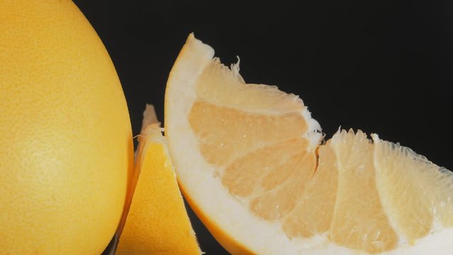Pomelo fruit, orange lith pulp rotating closeup