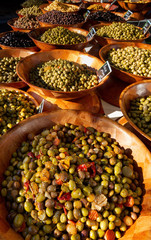 Big bowls of different kind of olives on display