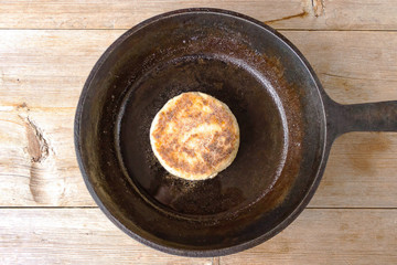 Russian syrniki baked fried cottage cheese pancakes curd fritters breakfast in cast iron skillet
