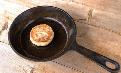Russian syrniki baked fried cottage cheese pancakes curd fritters breakfast in cast iron skillet