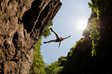 Shot of the falling female climber from below