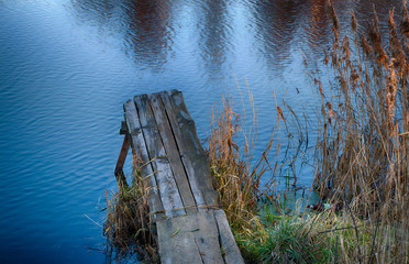 River pier in sedge and calamus. Relaxation and relaxation on the beach. Belarus. Salihorsk.