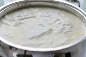 Step cooking cottage cheese, sourdough milk in a saucepan