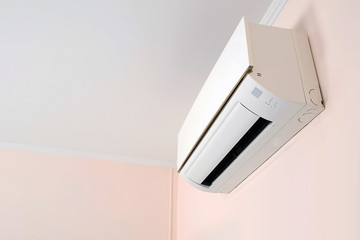 Wall mounted air conditioner in livingroom after cleaning and maintenance.