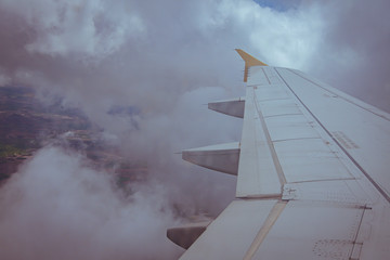 Views of the earth between clouds from an airplane