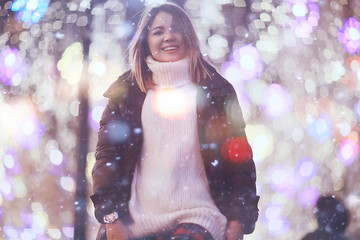 snowfall woman city christmas outside, city portrait in snowfall, young model posing in festive look