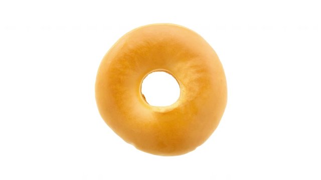 Top view of various colorful donuts isolated on white background. Stop motion 