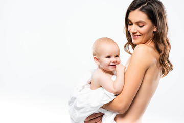 portrait of cheerful naked mother holding baby, isolated on white
