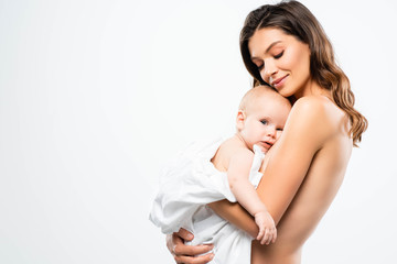 portrait of smiling naked mother hugging baby, isolated on white