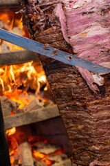 roast lamb meat on wood fire
