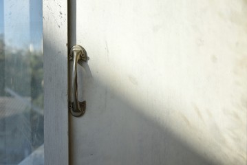  wooden door with lock on the sunlight background