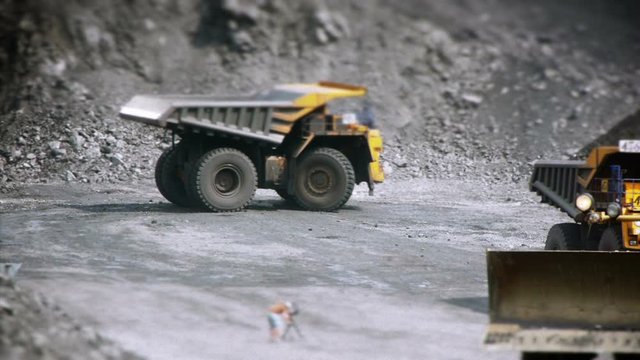 Mining Dump Truck loading excavator heavy track