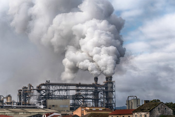 Chemical factory with smoke stack. Smoke emission from factory pipes. Ecology and environmental...
