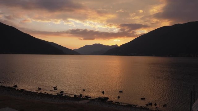 Lugano Lake. Bissone, tiny village on the lake. Cold winter sunset