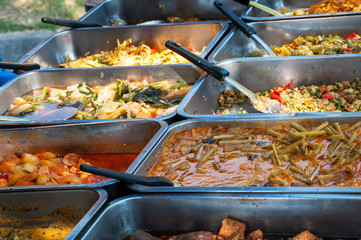 A variety of Thai food in a tray
