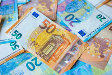 Background of 20 and 50 value Euro money bill close up
