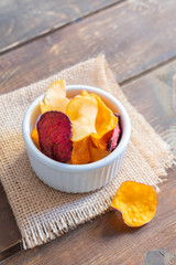 Healthy vegetable crisps made from carrots, beetroot, parsnip, sweet potato in a bowl