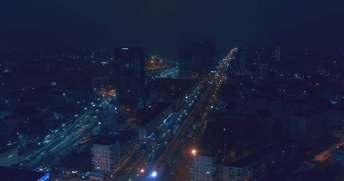 Top down aerial view of night streets in downtown Kyiv, Ukraine, with bright night lighting. Wide shot on dji mavic 2 pro hasselblad camera with smooth cinematic drone motion 