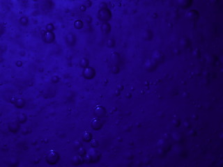 Bubbles in a blue bottle
