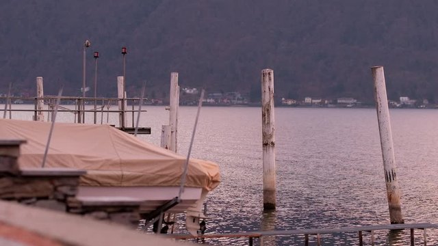 Lugano Lake. Walk Through on Pier in Bissone, tiny village on the lake. Cold
