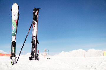 Alpine skis and Snowboards at snow ski resort vacation travel