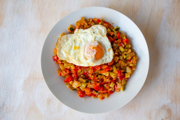 Spanish dish pisto manchego with fried egg