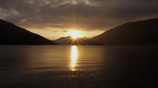 Lugano Lake. Backlight Sunset on the lake